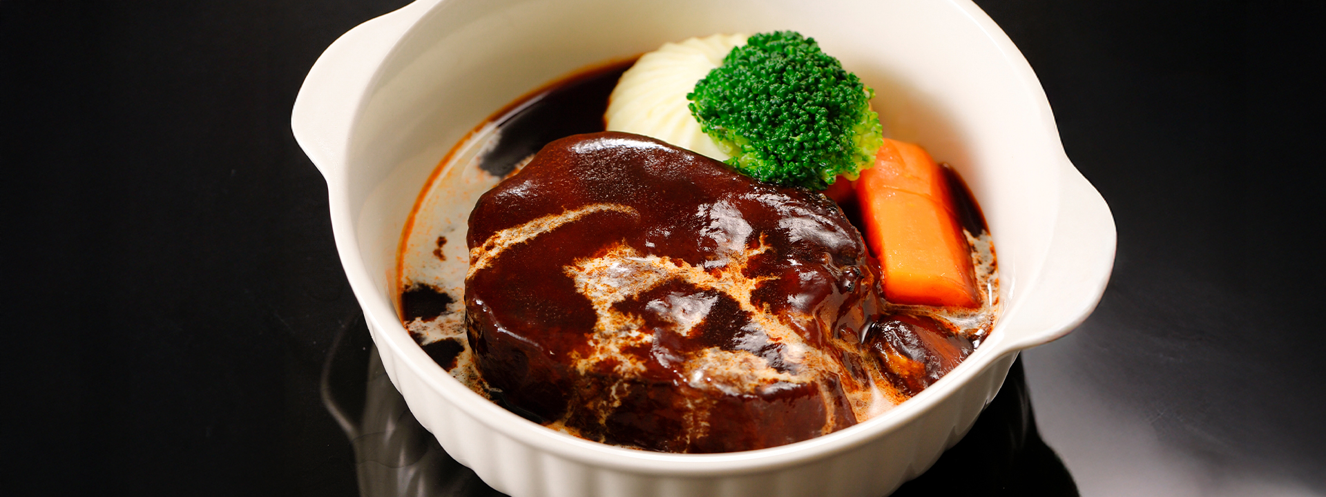 Braised beef tongue in demi-glace sauce with aromatic spices